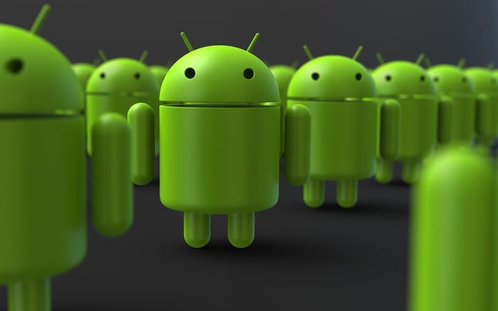 Google android robots standing in a group